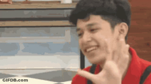 Young Man In Red Shirt Smiling Peace Sign GIF