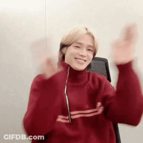 Young Man In Red Sweater Making Funny Face GIF