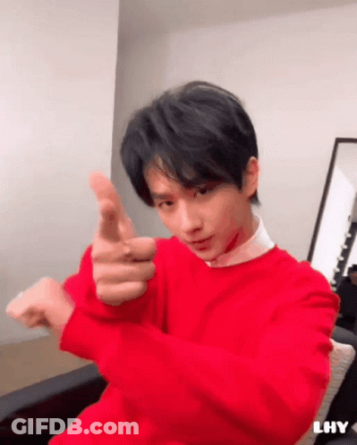 Young Man In Red Sweater Pointing At Camera GIF