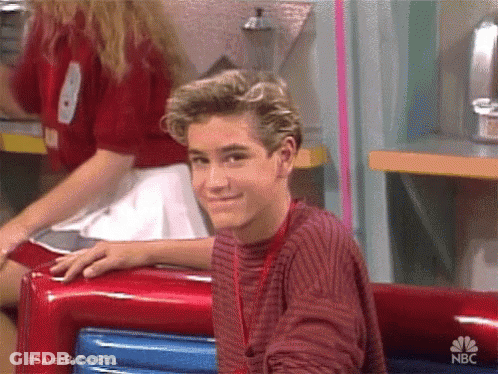Young Man In Red Sweater Sitting In Diner GIF