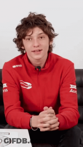 Young Man In Red Sweatshirt With ACT On Sleeves GIF
