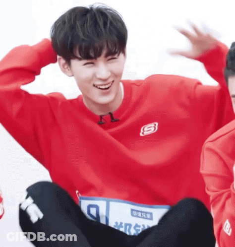 Young Man In Red Sweatshirt With Letter S GIF
