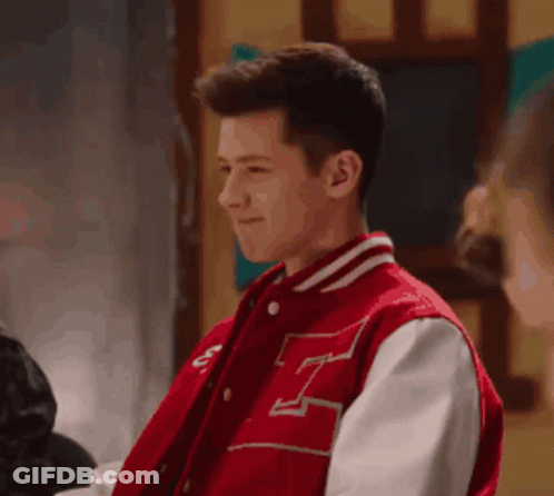 Young Man In Red Varsity Jacket With Letter H GIF