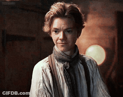 Young Man In Scarf And Suspenders GIF