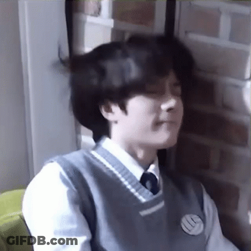 Young Man In School Uniform Making Funny Face GIF