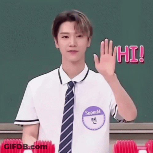 Young Man In School Uniform Waving At Greenboard GIF