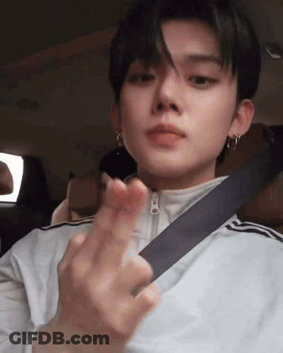 Young Man In Seat Belt Making Heart Shape GIF
