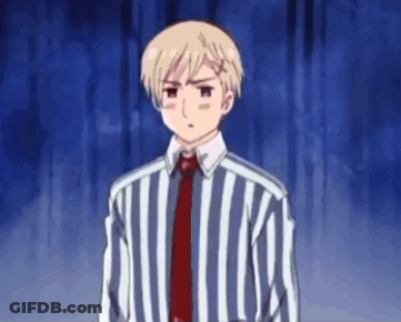 Young Man In Striped Shirt And Tie At Blue Curtain GIF