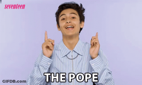 Young Man In Striped Shirt Pointing At Camera Saying The Pope GIF