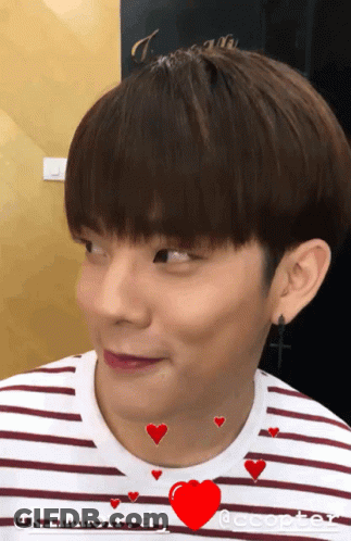 Young Man In Striped Shirt With Red Heart GIF