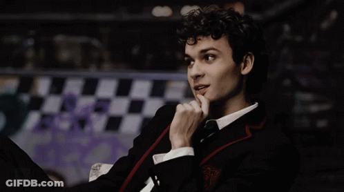Young Man In Suit And Tie Finger On Chin GIF
