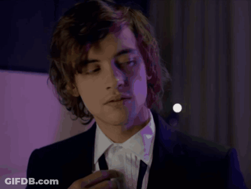 Young Man In Suit And Tie Looking GIF