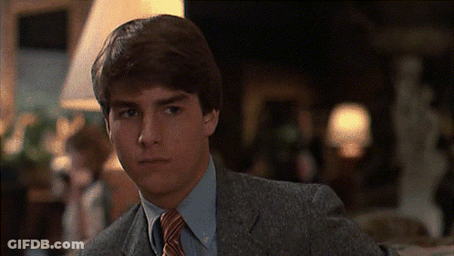 Young Man In Suit And Tie Looking At Camera GIF
