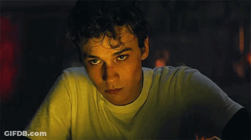 Young Man In Suit And Tie Looking Up GIF