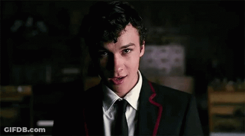 Young Man In Suit And Tie Smiling GIF