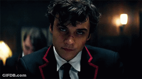 Young Man In Suit And Tie With Bloody Nose GIF
