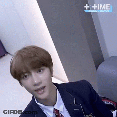 Young Man In Suit And Tie With + Time Sign GIF