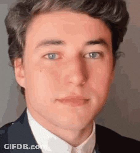 Young Man In Suit And White Shirt GIF
