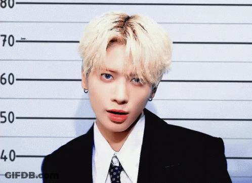 Young Man In Suit In Police Lineup GIF