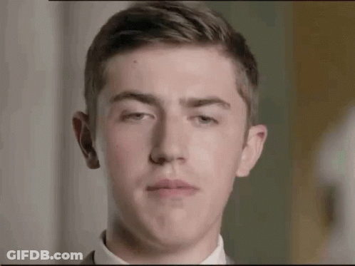 Young Man In Suit Making Face GIF