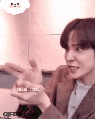 Young Man In Suit Making Funny Face With Hands Out GIF