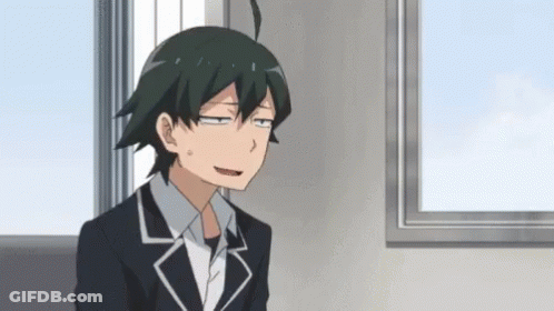 Young Man In Suit Sitting In Front Of Window GIF