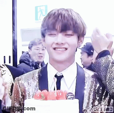 Young Man In Suit Smiling With Cake And Strawberries GIF