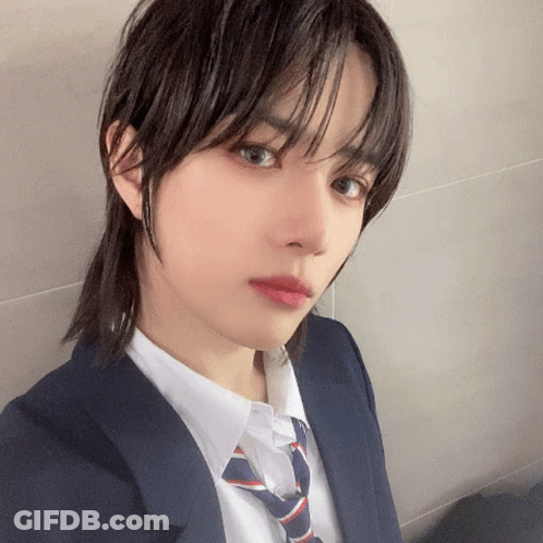 Young Man In Suit Taking Selfie GIF