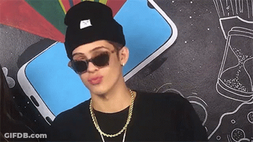 Young Man In Sunglasses And Beanie Making Funny Face GIF
