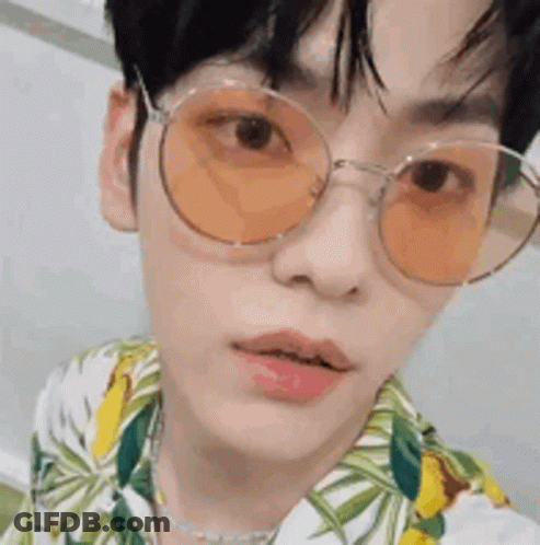 Young Man In Sunglasses And Floral Shirt GIF