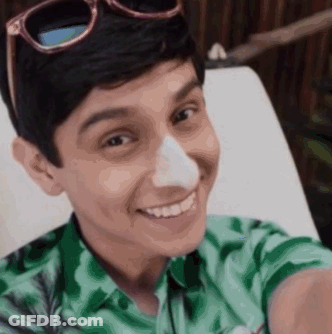 Young Man In Sunglasses And Green Shirt With Nose Ring GIF