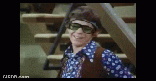 Young Man In Sunglasses And Headband On Stairs GIF