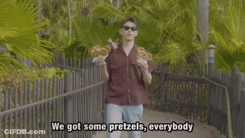 Young Man In Sunglasses Holding Pretzels Saying Got Some Pretzels GIF