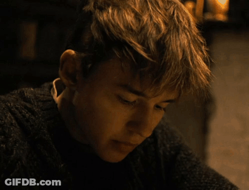 Young Man In Sweater Close Up GIF