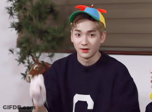 Young Man In Sweater With Letter C Holding Stuffed Animal GIF