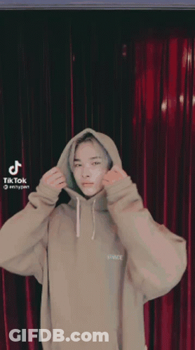 Young Man In Tan Hoodie Saying Space GIF