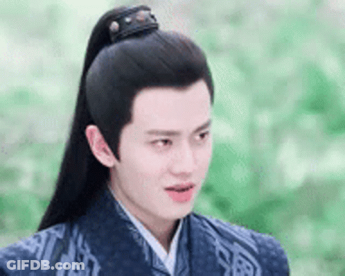 Young Man In Traditional Costume With Long Black Ponytail GIF