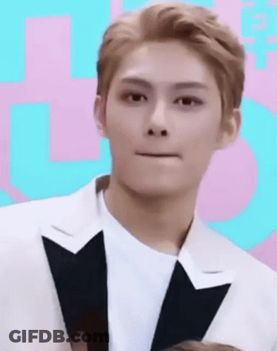 Young Man In Tuxedo Making Funny Face GIF