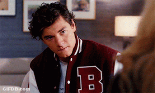 Young Man In Varsity Jacket With B GIF