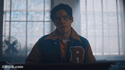 Young Man In Varsity Jacket With Letter R GIF