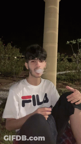 Young Man In White Fila T-Shirt Smoking Cigarette GIF