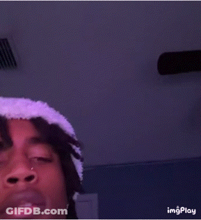 Young Man In White Hat And Purple Shirt Taking Selfie GIF