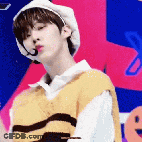 Young Man In White Hat And Yellow Vest GIF