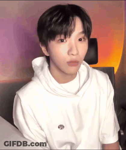 Young Man In White Hoodie Making Funny Face GIF
