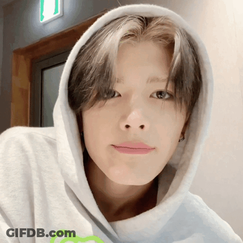 Young Man In White Hoodie With Green Heart GIF
