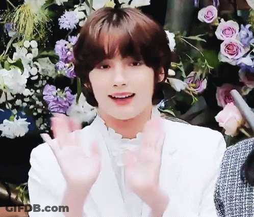 Young Man In White Jacket Making Heart With Hands GIF