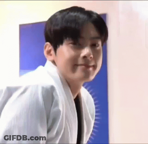 Young Man In White Karate Uniform Making A Face GIF
