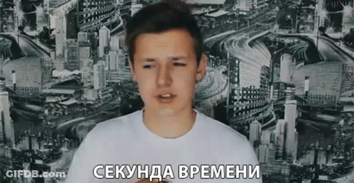 Young Man In White Shirt Against Cityscape Wall GIF