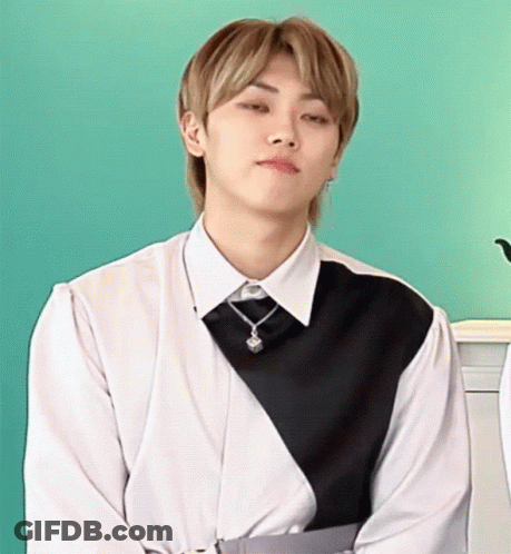 Young Man In White Shirt And Black Vest GIF