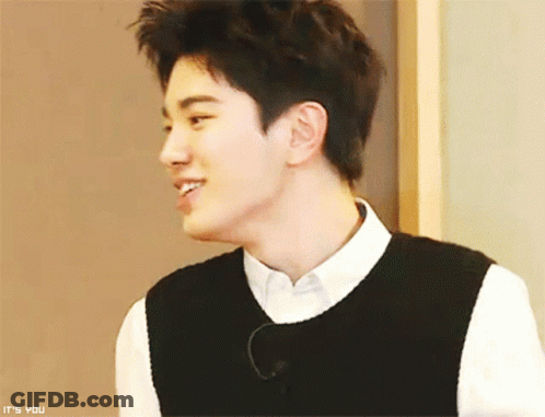 Young Man In White Shirt And Black Vest Says It's You GIF